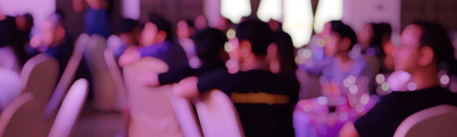 A blurred photo of a party crowd.