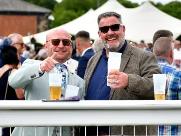Two gents at Newcastle Races giving a thumbs up