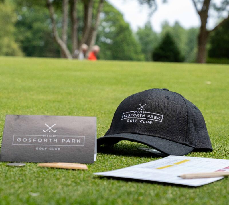 high gosforth park golf, hat, score sheet on lawn
