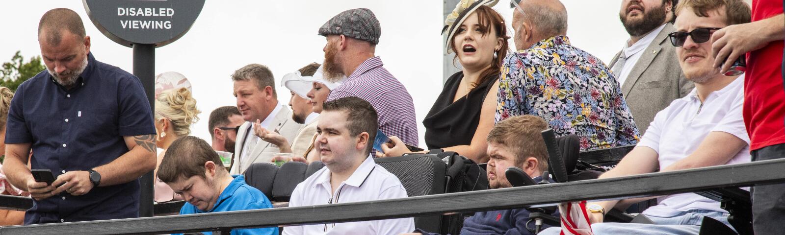 A group of racegoers enjoying their raceday at Newcastle from the viewing platform