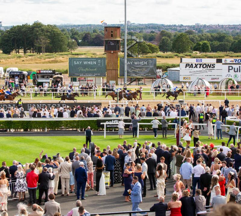 The crowds lining the track at Newcastle Racecourse