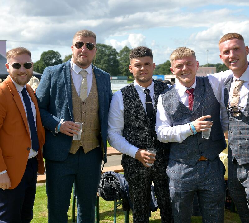 Five gents dressed in waistcoats at the races