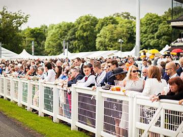 Crowds gathered at the races at Newcastle Racecourse.